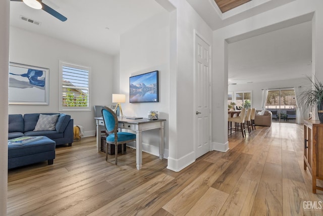 9700 Kingsport Pl, Bakersfield, CA 93306 - home office with a ceiling fan, light wood-type flooring, healthy amount of natural light, and baseboards