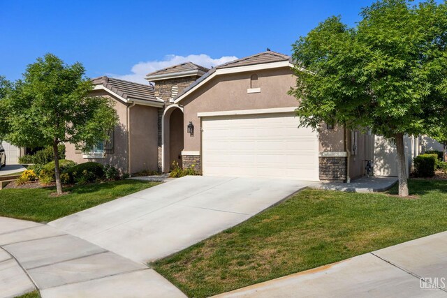 9700 Kingsport Pl, Bakersfield, CA 93306 - view of front of house featuring stone siding, stucco siding, a tile roof, and a garage