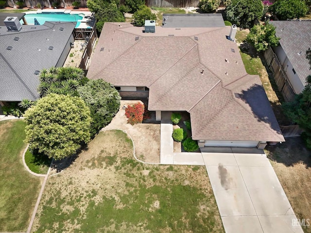 aerial view of property and surrounding area with a pool
