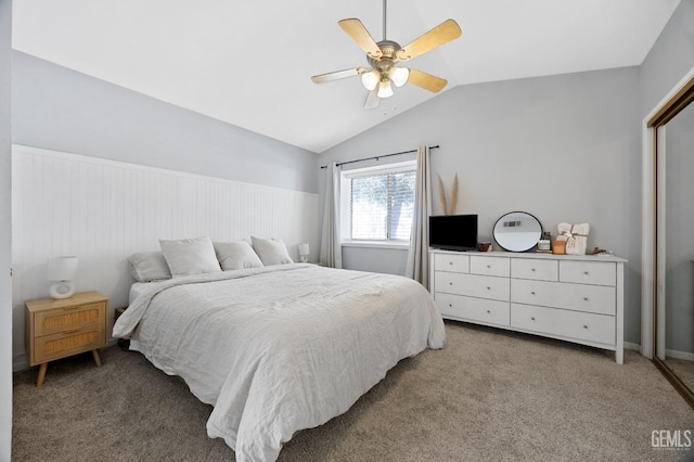 bedroom featuring ceiling fan, lofted ceiling, and carpet