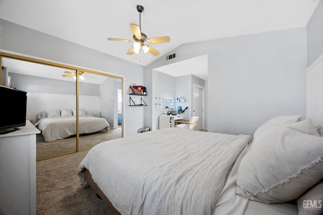 carpeted bedroom featuring vaulted ceiling, a closet, and ceiling fan