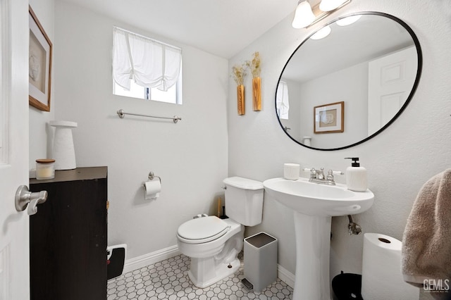 bathroom featuring toilet and sink