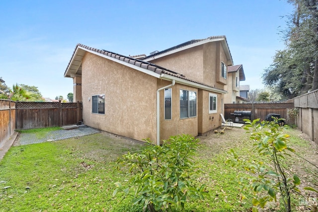 rear view of house with a patio