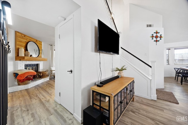 interior space with a fireplace and light wood-type flooring