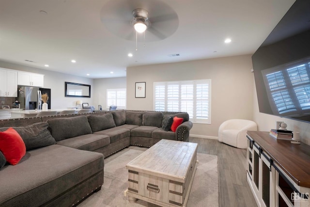 8615 Littleton St, Bakersfield, CA 93314 - living room with ceiling fan and light hardwood / wood-style floors