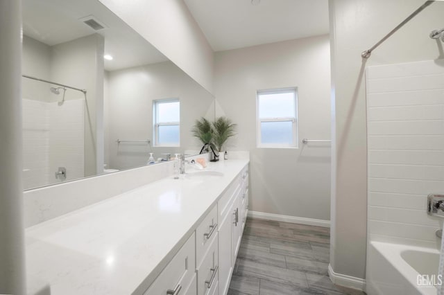 8615 Littleton St, Bakersfield, CA 93314 - bathroom featuring vanity, plenty of natural light, and shower / washtub combination