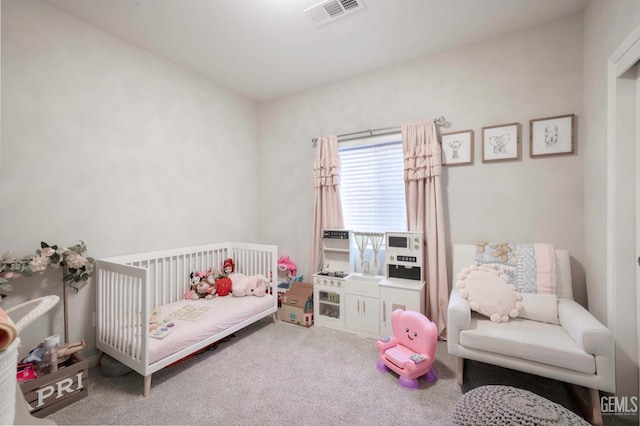8615 Littleton St, Bakersfield, CA 93314 - carpeted bedroom featuring a nursery area