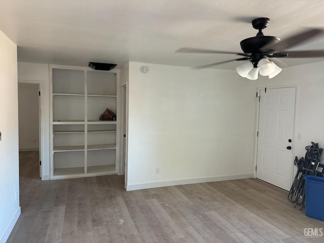 empty room featuring ceiling fan and light wood-type flooring