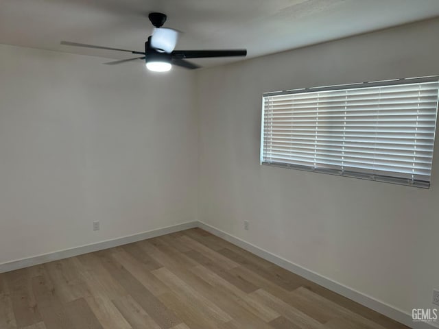 unfurnished room featuring light hardwood / wood-style flooring and ceiling fan