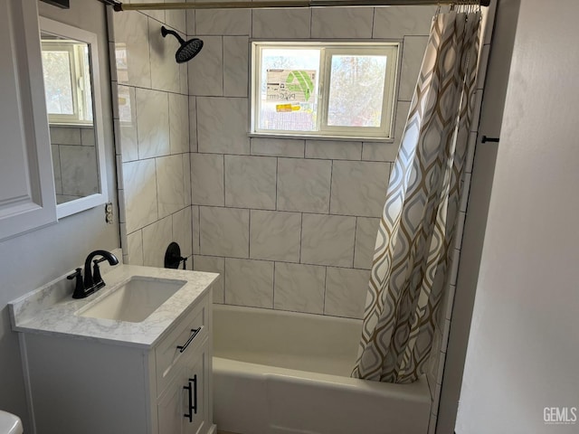 bathroom featuring vanity and shower / tub combo