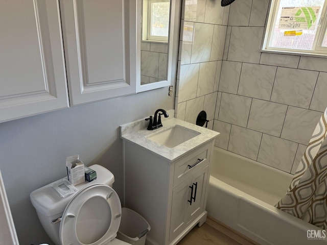 full bathroom featuring vanity, shower / tub combo, and toilet