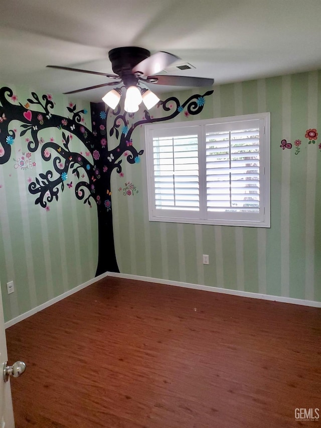 5429 White Wheat Ave, Bakersfield, CA 93313 - spare room featuring wood finished floors, ceiling fan, and wallpapered walls