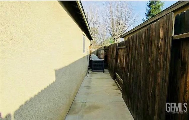5429 White Wheat Ave, Bakersfield, CA 93313 - view of home's exterior featuring stucco siding and a cooling unit