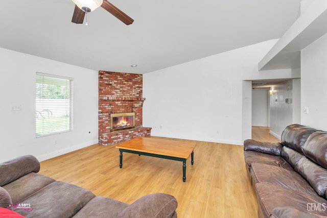 9812 Marilee Ave, Bakersfield, CA 93312 - living area featuring a ceiling fan, light wood-style floors, a fireplace, baseboards, and lofted ceiling