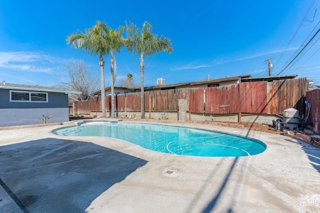 view of swimming pool with a patio area, a fenced backyard, and a fenced in pool