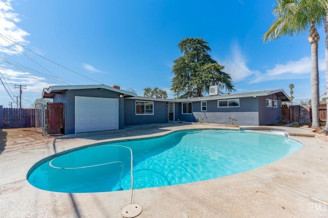 view of pool with a fenced in pool and fence