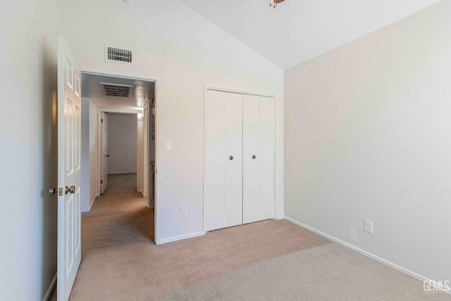 5500 Lennox Ave Unit 20, Bakersfield, CA 93309 - unfurnished bedroom with light colored carpet, a closet, and high vaulted ceiling