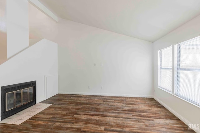 5500 Lennox Ave Unit 20, Bakersfield, CA 93309 - unfurnished living room with wood finished floors, a fireplace, and vaulted ceiling