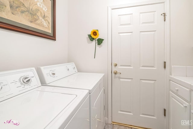 laundry room featuring washing machine and clothes dryer