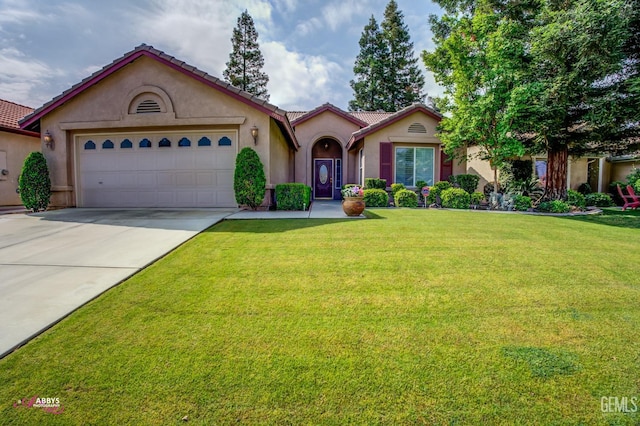 mediterranean / spanish-style house featuring a garage and a front lawn