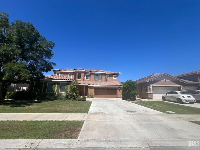 mediterranean / spanish-style house with a front lawn and a garage