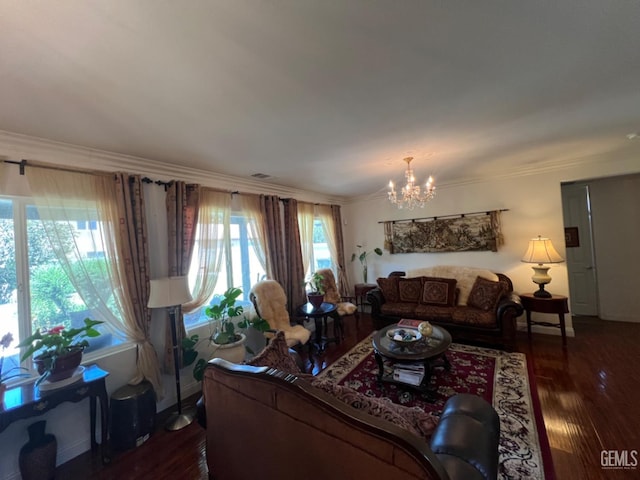 living room with a healthy amount of sunlight, dark hardwood / wood-style floors, and an inviting chandelier