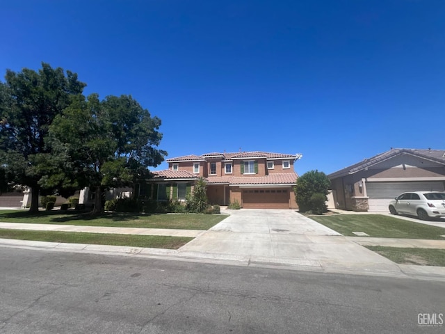 view of front facade with a garage and a front yard