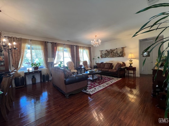 living room featuring ornamental molding, dark hardwood / wood-style floors, and a notable chandelier