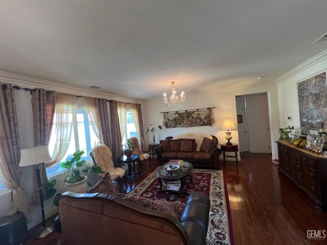 living room with crown molding, dark wood-type flooring, and a notable chandelier