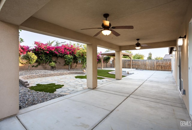 9029 Midnight Creek Way, Bakersfield, CA 93311 - fenced backyard featuring a ceiling fan, a patio, and a gazebo