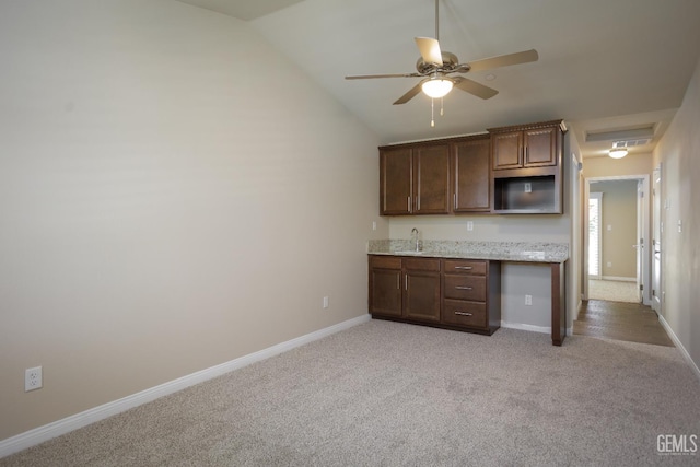 9029 Midnight Creek Way, Bakersfield, CA 93311 - kitchen with light carpet, a ceiling fan, lofted ceiling, and light stone counters