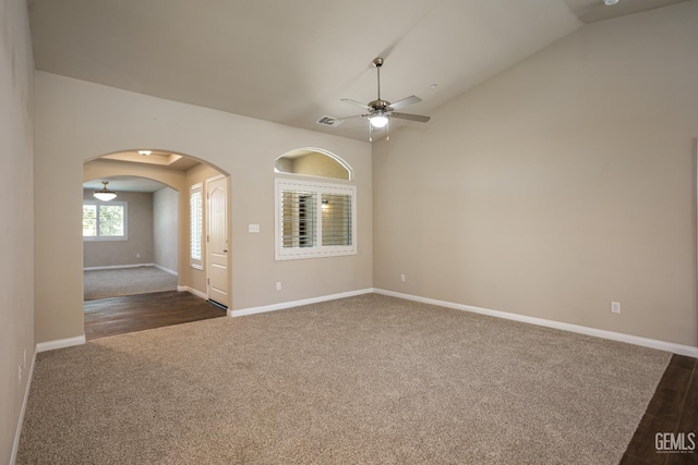 9029 Midnight Creek Way, Bakersfield, CA 93311 - unfurnished room featuring dark colored carpet, arched walkways, a ceiling fan, and vaulted ceiling