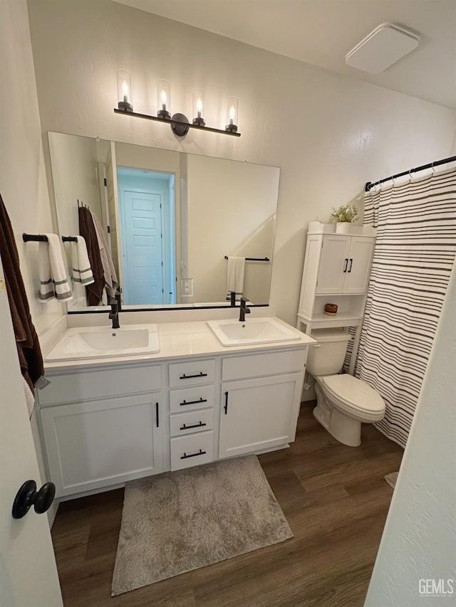 6722 Glacier Bay St, Bakersfield, CA 93313 - bathroom with wood finished floors, double vanity, and a shower with shower curtain