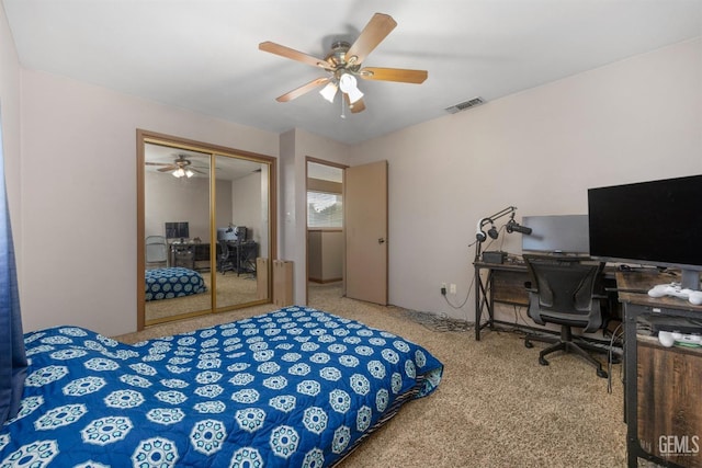 bedroom with carpet flooring, a closet, and ceiling fan