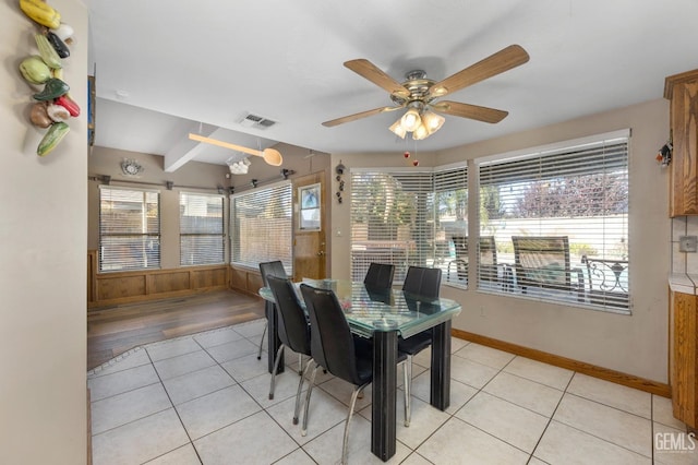 tiled dining room featuring ceiling fan