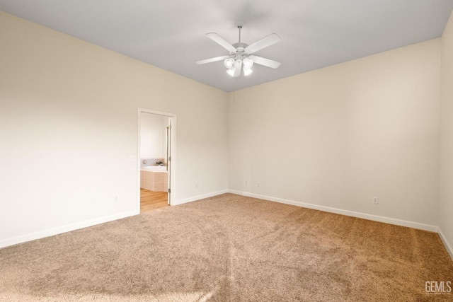 carpeted empty room featuring ceiling fan