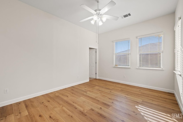 unfurnished room with light wood-type flooring and ceiling fan