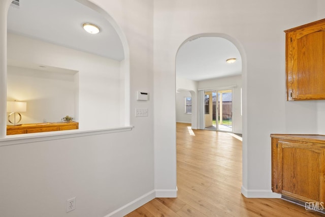 corridor featuring light hardwood / wood-style floors