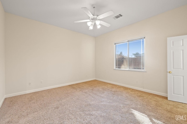 carpeted empty room with ceiling fan