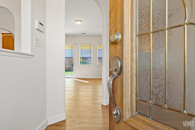 corridor with light hardwood / wood-style floors