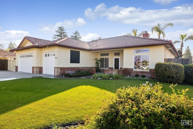 view of front of home featuring a garage and a front yard