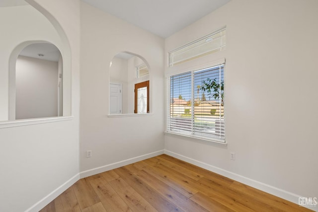 spare room with light wood-type flooring