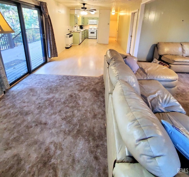 living area featuring a ceiling fan
