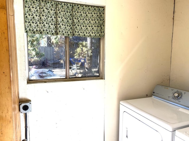 washroom featuring washer and dryer and laundry area