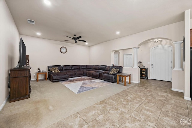 9510 Midnight Creek Way, Bakersfield, CA 93311 - living area with arched walkways, a ceiling fan, recessed lighting, light carpet, and ornate columns