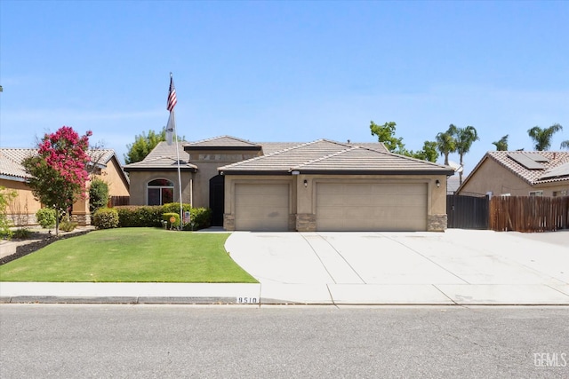 9510 Midnight Creek Way, Bakersfield, CA 93311 - view of front of home with a garage, driveway, stucco siding, stone siding, and a tile roof