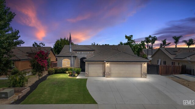 9510 Midnight Creek Way, Bakersfield, CA 93311 - ranch-style house with a garage, concrete driveway, stucco siding, and stone siding