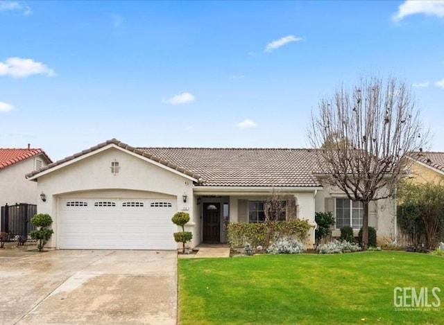 view of front of house featuring a garage and a front lawn