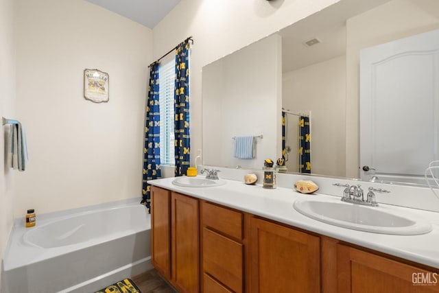 bathroom featuring a bathing tub and vanity