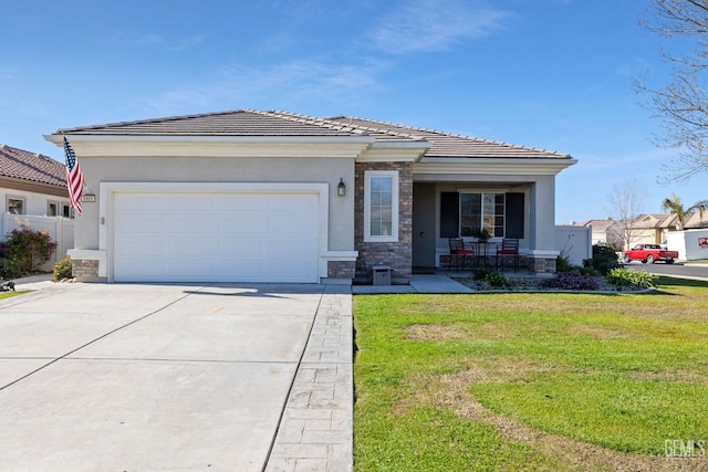 view of front of home featuring a garage, a front lawn, and a porch